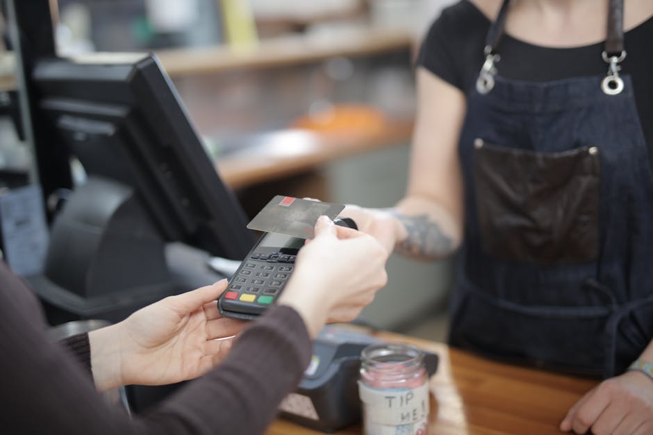 Client making credit card payment with tip at salon checkout